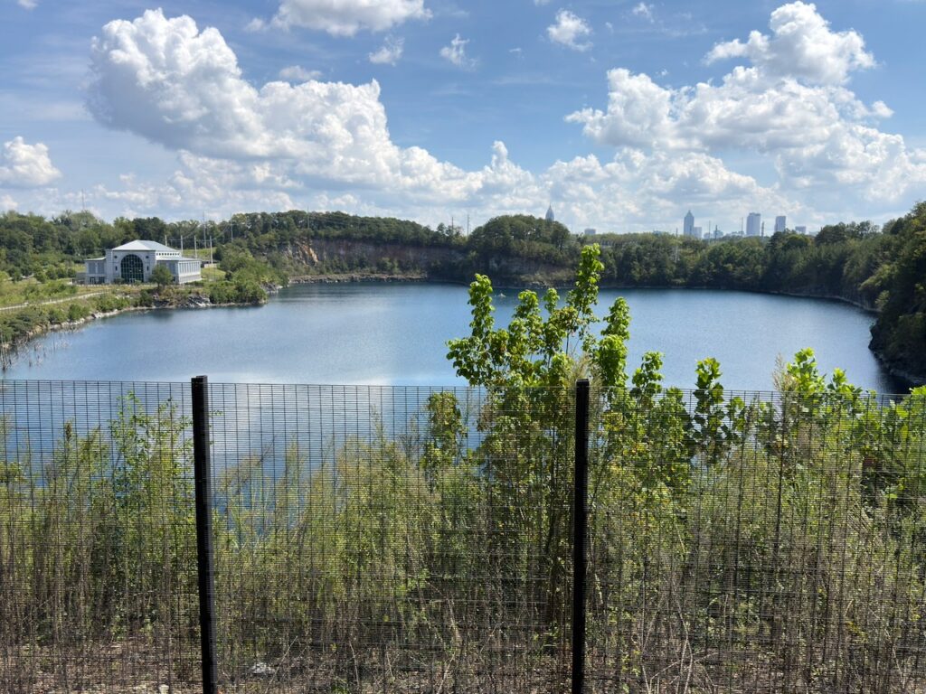 The flooded quarry from the park's overlook, the skyline beyond.